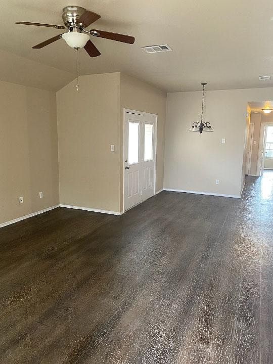 Open concept living and dining spaces with new flooring.
