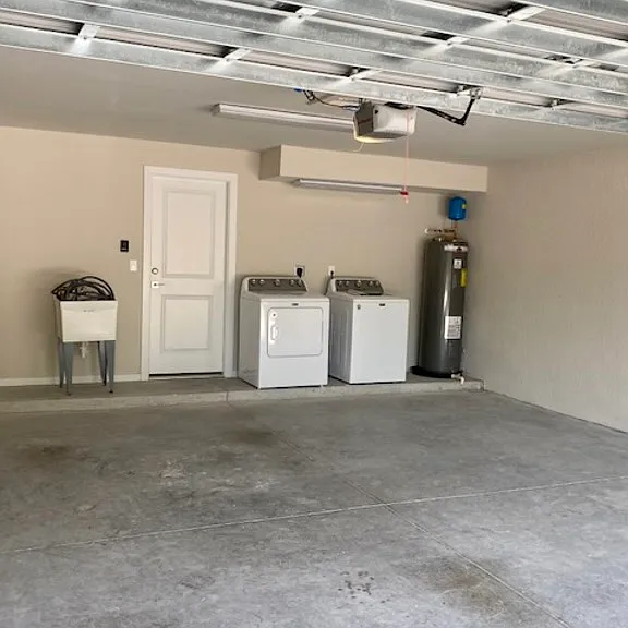 washer, dryer and laundry tub in the 2 car garage with remote openers.