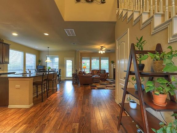 Stunning wood floors in the dining, entry kitchen and living room.