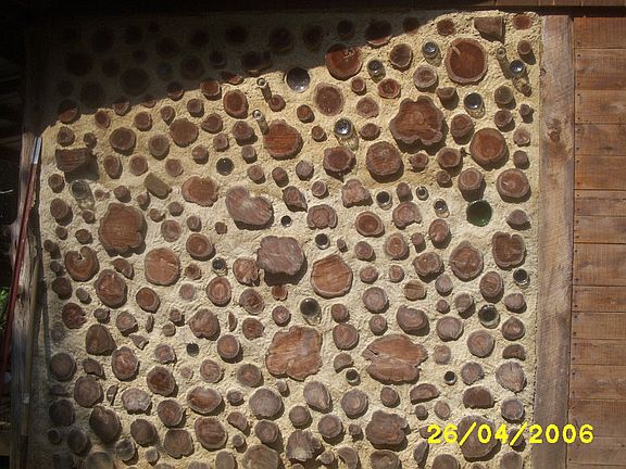 Outside of largest cord wood wall                                             
