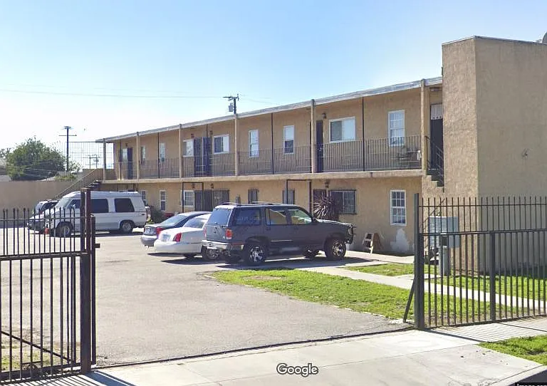 Outside building, unit located upstairs