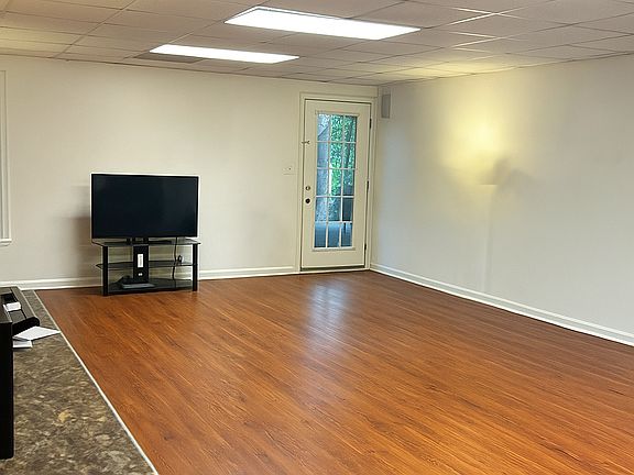 Entrance Family Room ( Main) off of Patio ( open -photo taken in kitchenette area top of room)