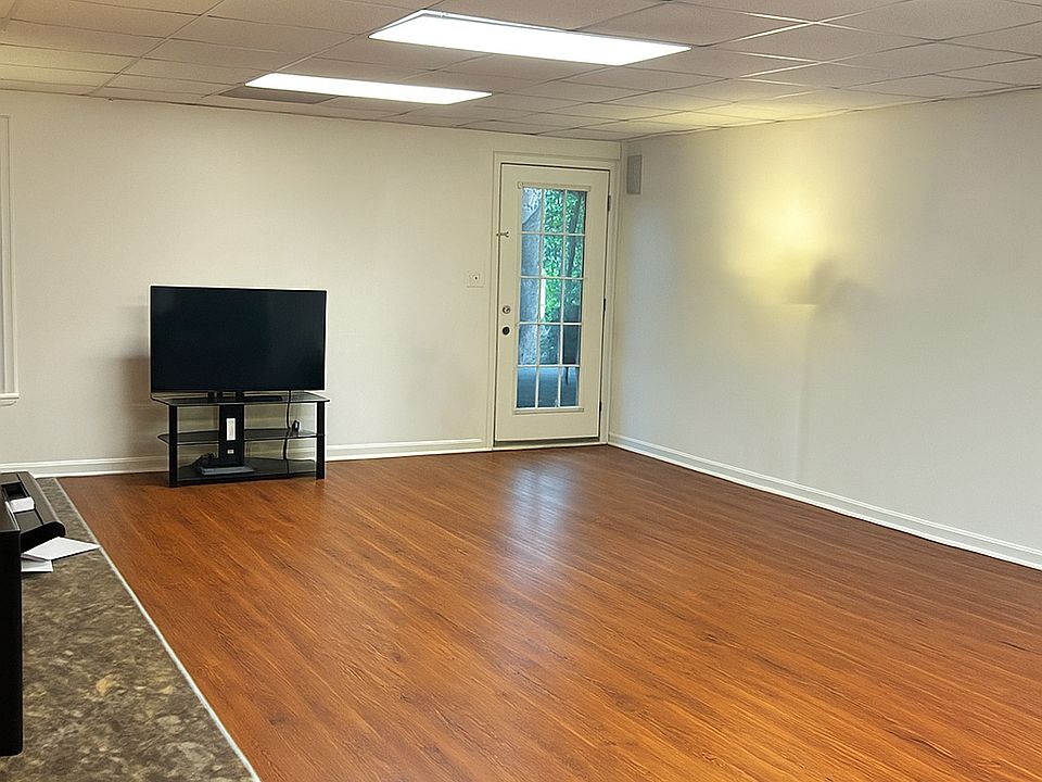Entrance Family Room ( Main) off of Patio ( open -photo taken in kitchenette area top of room)