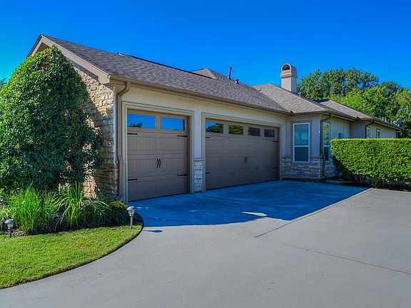 THREE CAR GARAGE WITH PLENTY OF STORAGE.