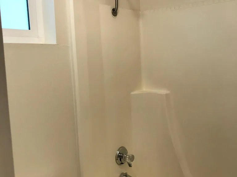 Bathroom with tub and shower