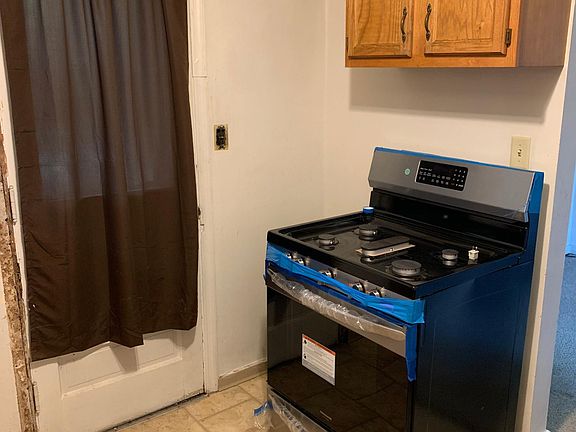 Kitchen with new stainless gas stove