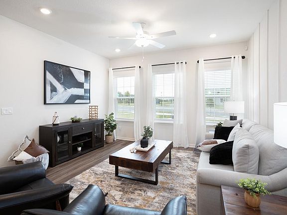 Enjoy a warm and open living area in your new bungalow in St. Cloud - Aria home plan by Highland Hom