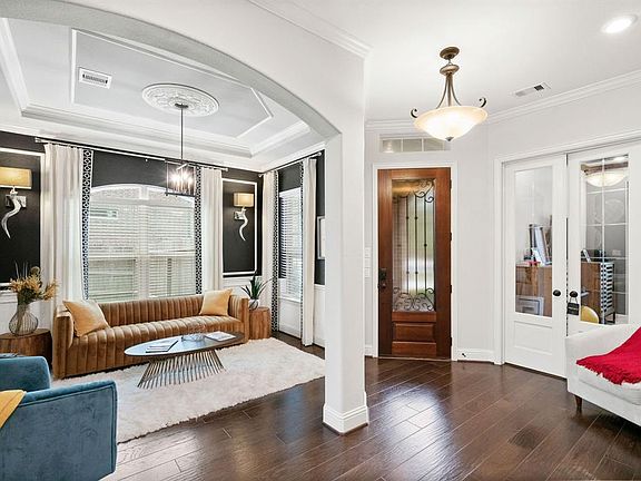 Formal dining currently being used as stylish sitting area. Note the extensive trim work.