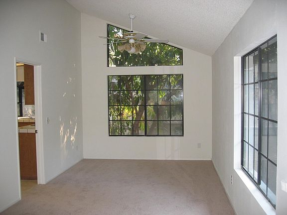 Bright living and dining area with vaulted ceilings