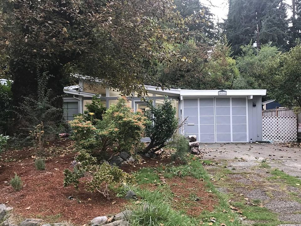 Front of the house. Driveway for off street parking. 1-car garage with bifold doors.