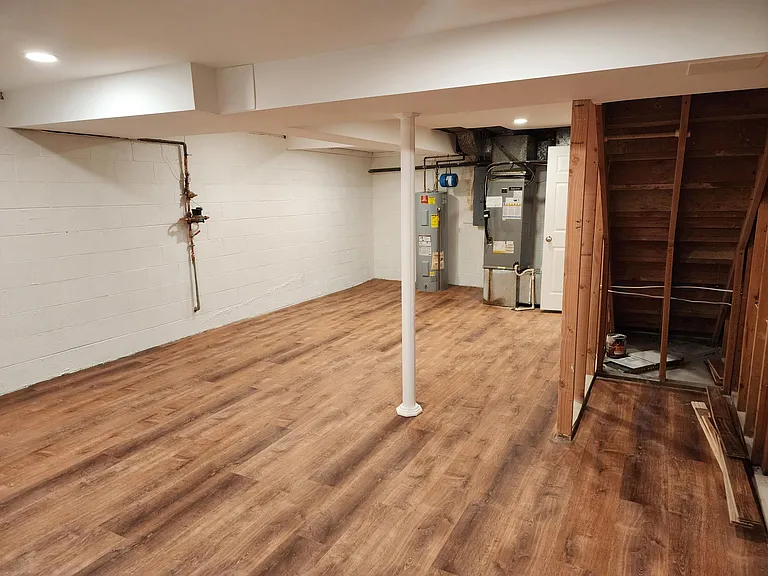 Basement with Washer/Dryer on opposite wall