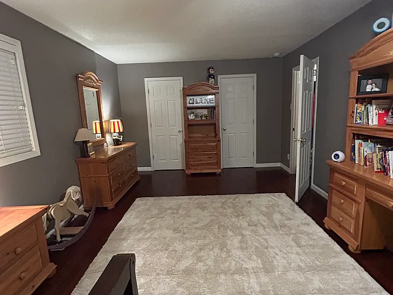 This is a very large bedroom in the front of the house. 
this bedroom is located directly across the hall from the front bathroom.