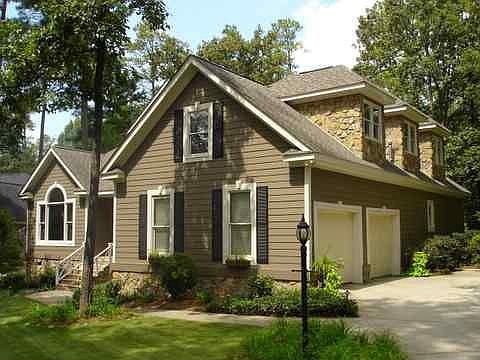 Stone dormers and side load garage