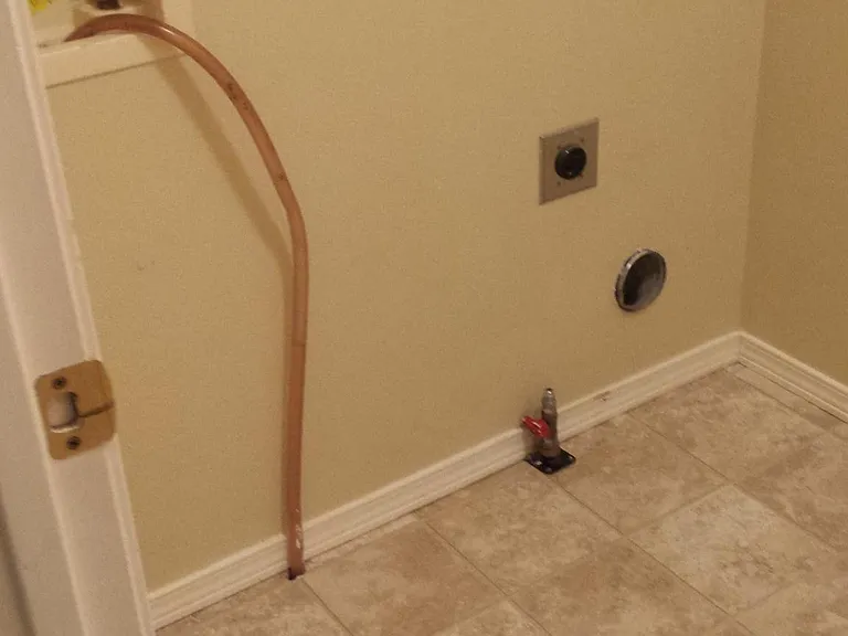 Laundry room hook-ups, Also has lot of shelves and countertop not shown
