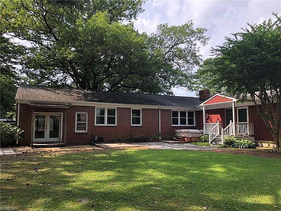 Rear exterior. Rear entry to the "man cave" and the primary bedroom.  