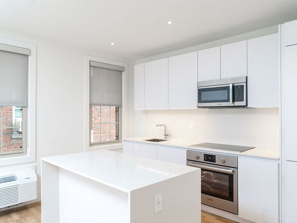 Updated kitchen with stainless steel appliances and granite countertops