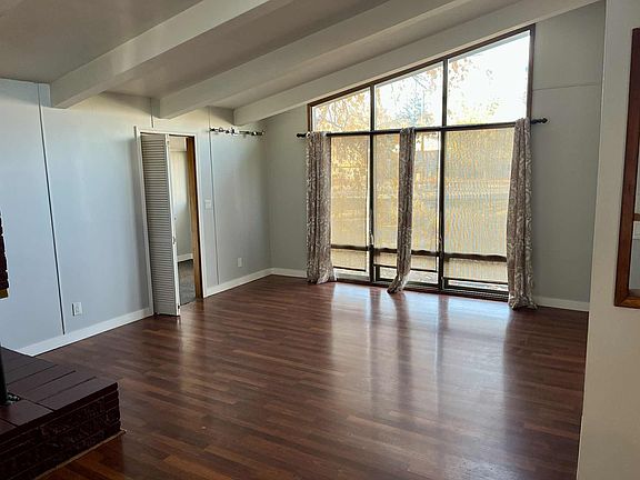 Living room with office space attached.