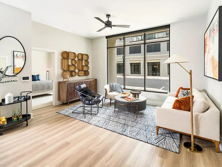 Bright and stylish, the living spaces at Modera Liberty Row feature expansive windows and refined finishes, creating a welcoming home in Charlotte.
