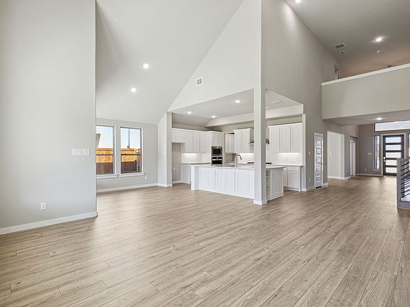 Living Room in the Morrison home plan by Trophy Signature Homes - REPRESENTATIVE PHOTO
