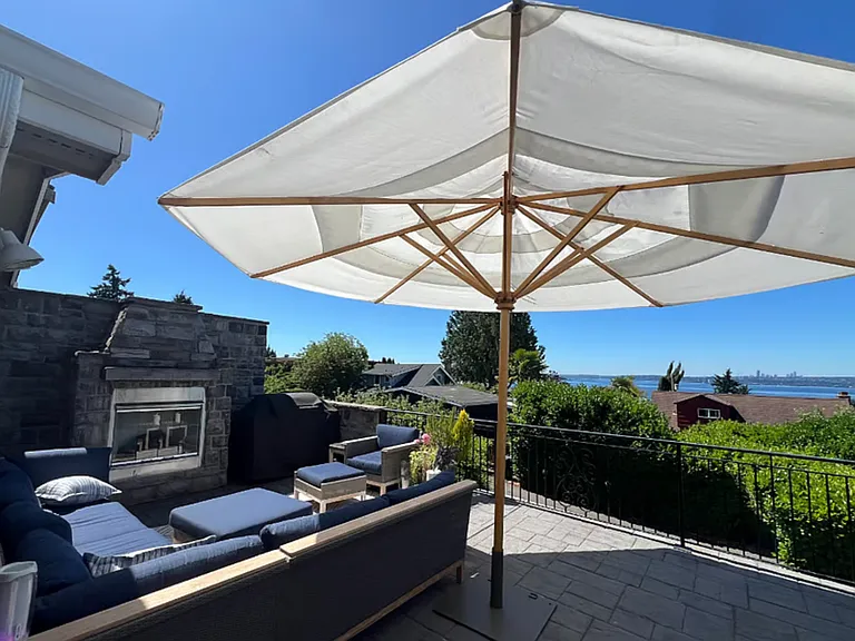 Outdoor Living Room area of main deck, (right off the Living, Dining Rooms and Kitchen) with gas fireplace, BBQ and Sweeping 180 degree views.