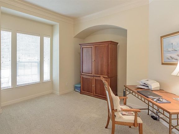 Large study with great window, crown molding and niche