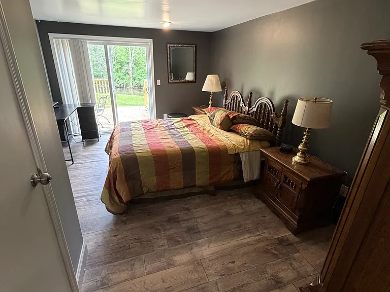 1st floor bedroom with direct access to the back deck