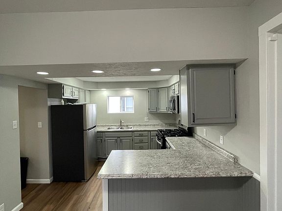 Kitchen all new counter tops, painted cabinets, new dishwasher , fridge, stove microwave!! window blind will be included.