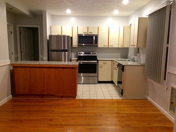 Kitchen opens to dining area