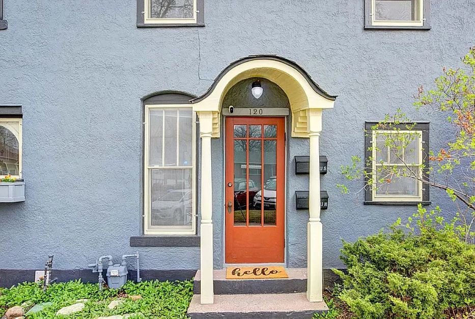 door to two upstairs apartments (Upper South and Upper North) with stairs to upstairs + shared hallway