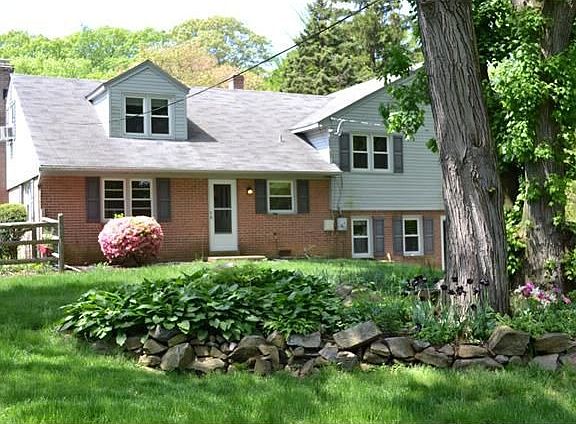 Back of home with beautiful view of yard