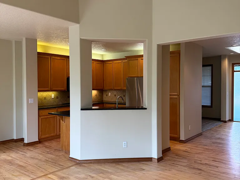 Hardwood floors in living room, entry and kitchen