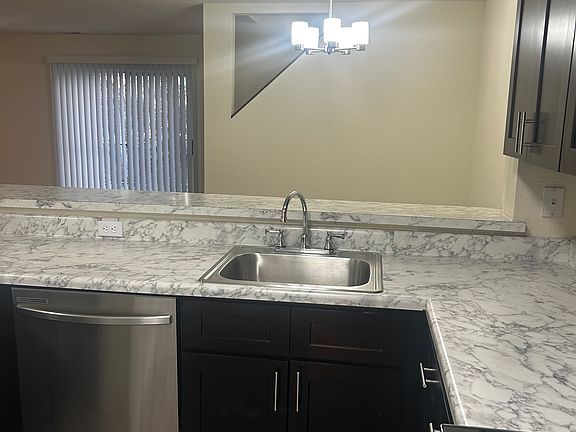 Kitchen with Huge Breakfast Bar overlooking Dining Room