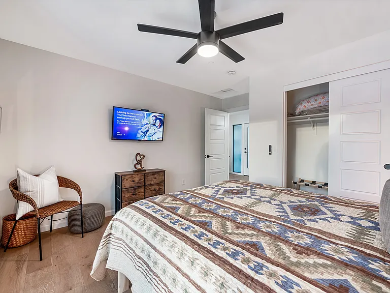 Bedroom #2: Queen bed overlooking backyard. Uses hallway bath, twin trundle