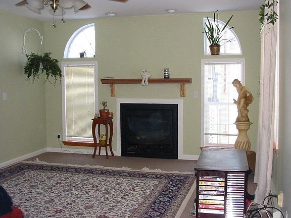 Cozy fireplace, custom windows.