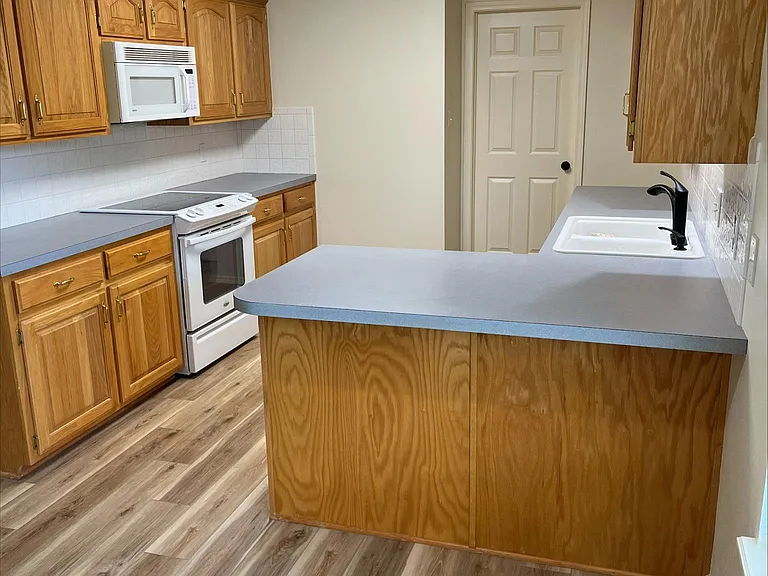 Kitchen with door to laundry room