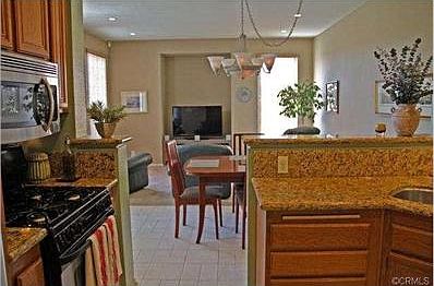 Remodeled kitchen with granite counters and stainless steel appl