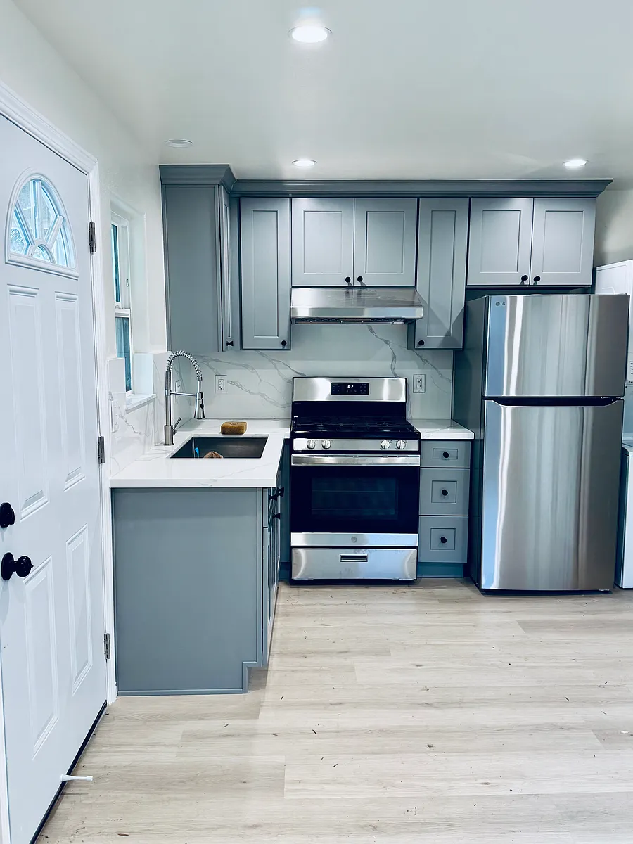 Modern open concept kitchen with brand new stainless steel appliances - Stove, oven, fridge, and stylish finishes. - 340 W 31st St