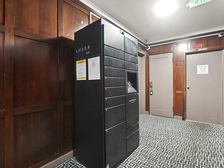 Hallway with a locker and an exit sign
