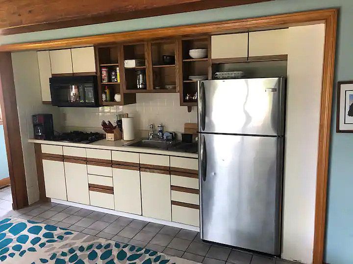 Kitchen - 4 burner gas stove, microwave, fridge (no oven)