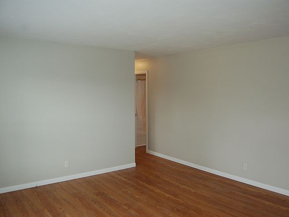 View from front door into the front room and down the hallway.