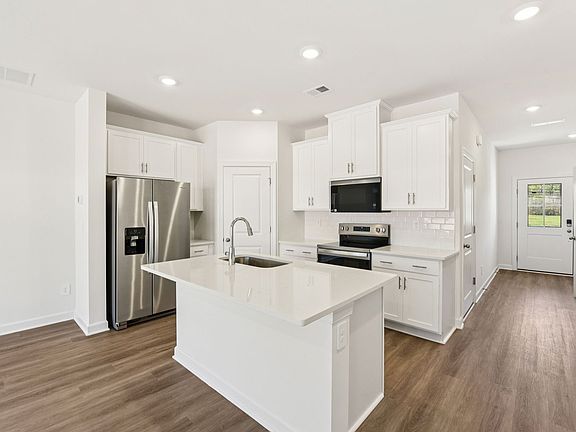 Cook your favorite meals in the sleek, modern kitchen.