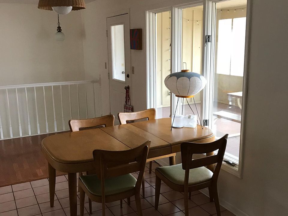 Kitchen dining area adjacent to screened-in porch.