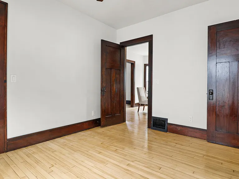 First bedroom. Notice lovely trim - original! Great Hardwoods!