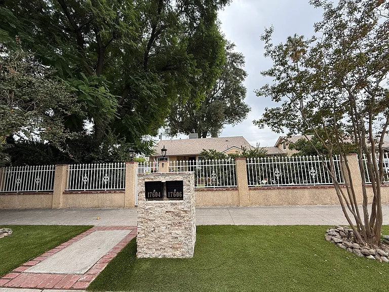 Front gated entry with locked mailboxes