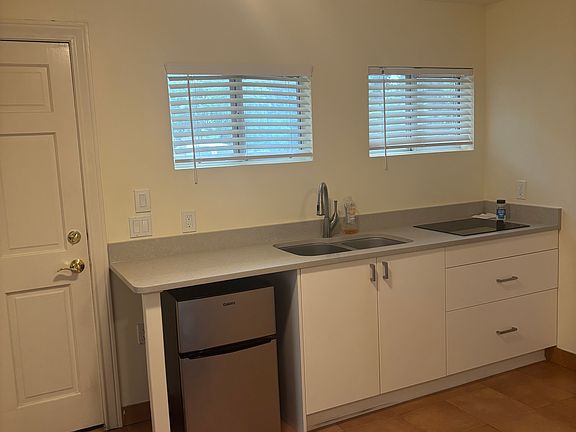 Sweet little kitchenette includes 2-burner stove top. Microwave included.