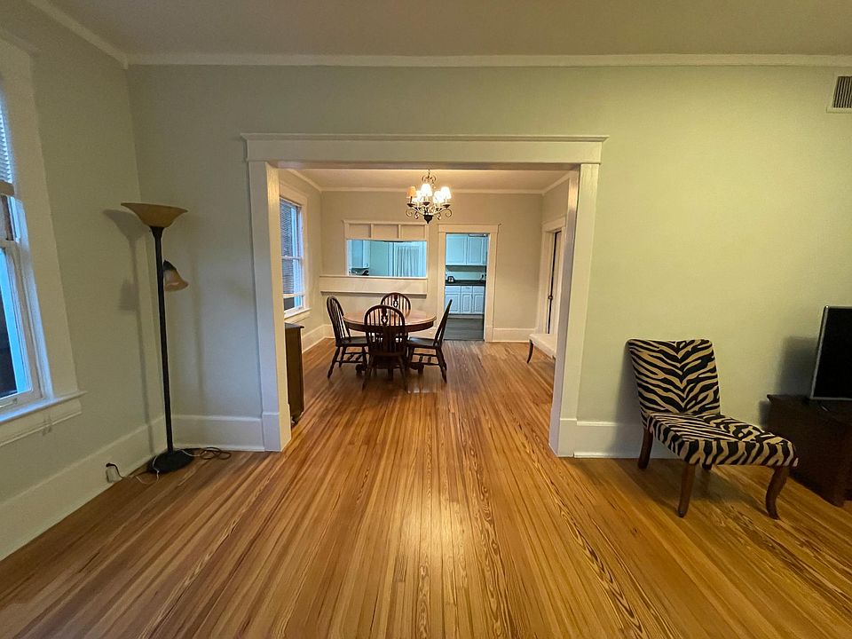 Living room view toward dining room and kitchen (COMES UNFURNISHED)