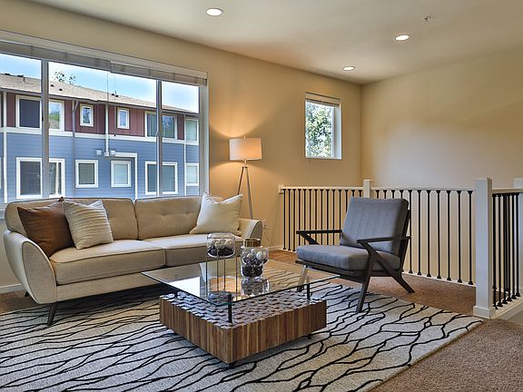 Light-filled living room on main floor. High ceilings add to the feeling of spaciousness.