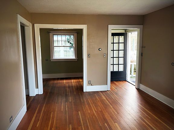 Living room looking toward dining nook and front door