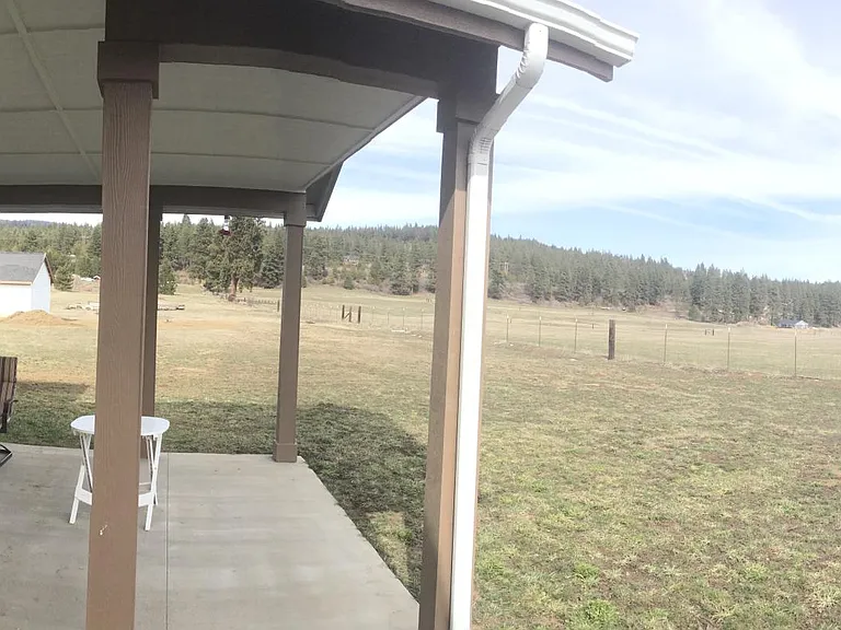 Covered back patio with views.