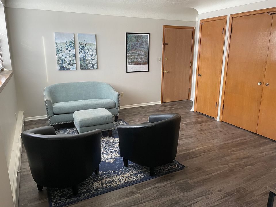 Spacious, well-lit living area with two closets.